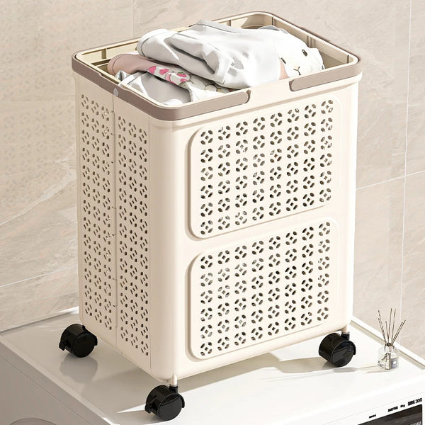 Cream foldable rolling laundry basket on wheels, filled with clothes beside a washing machine