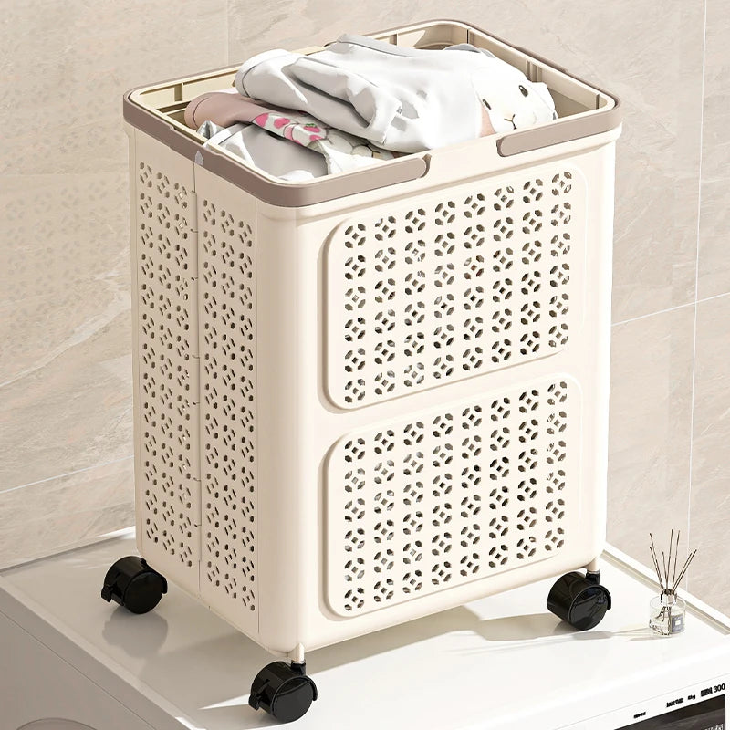 Cream foldable rolling laundry basket on wheels, filled with clothes beside a washing machine