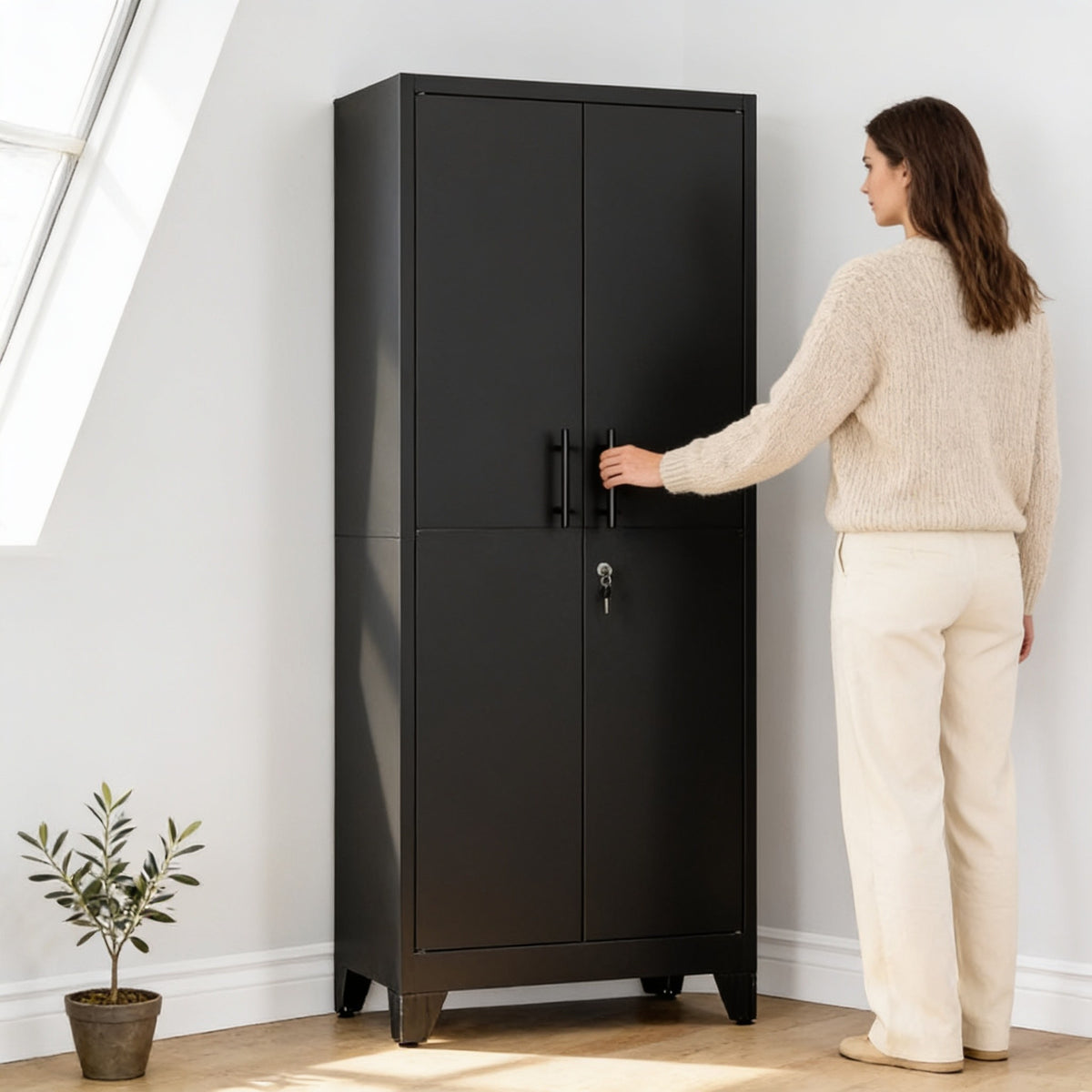 Adult standing beside the 180 cm tall black metal storage cabinet, the top of which reaches just above the top of her head.