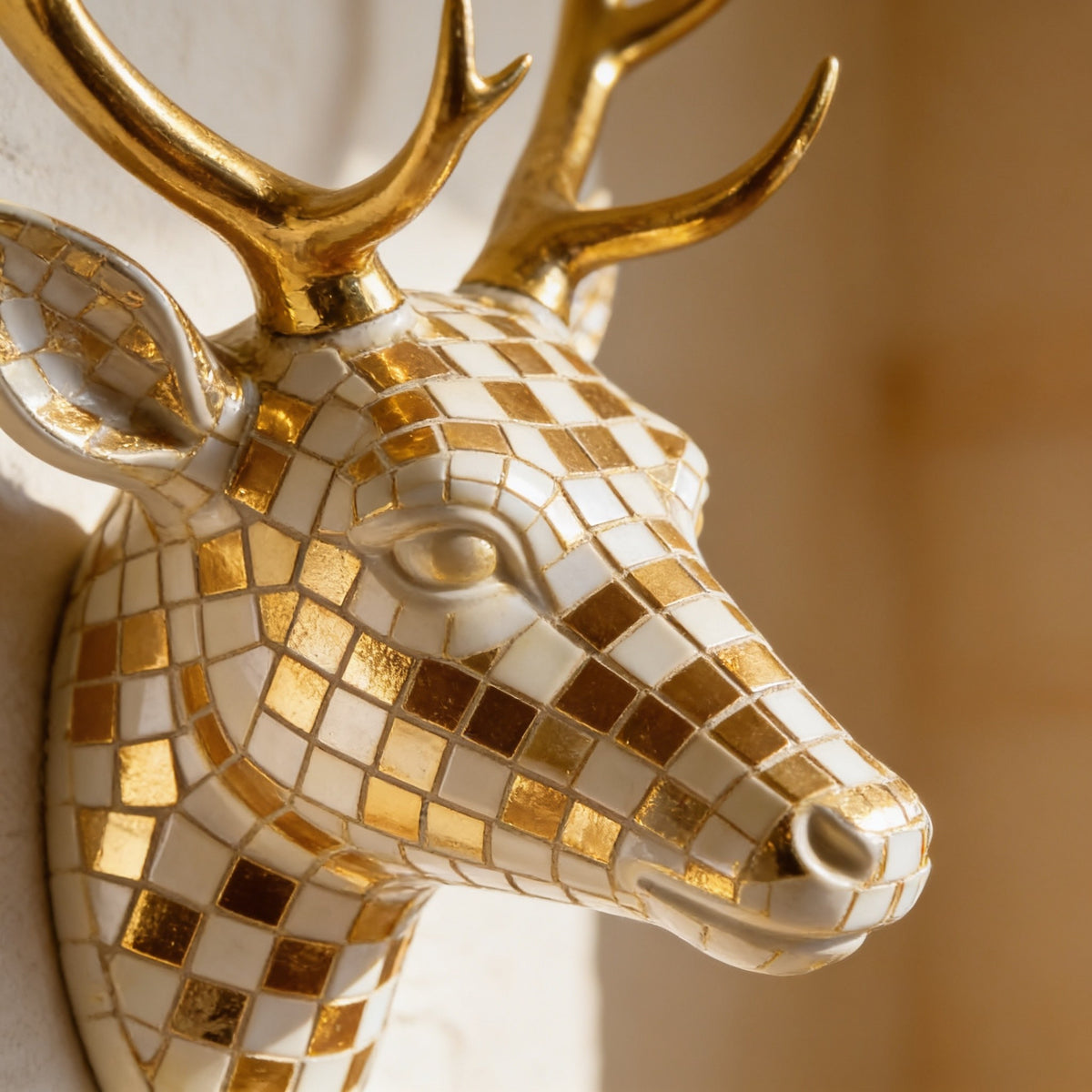 Close detail of the gold and cream checkered mosaic on the deer's face.
