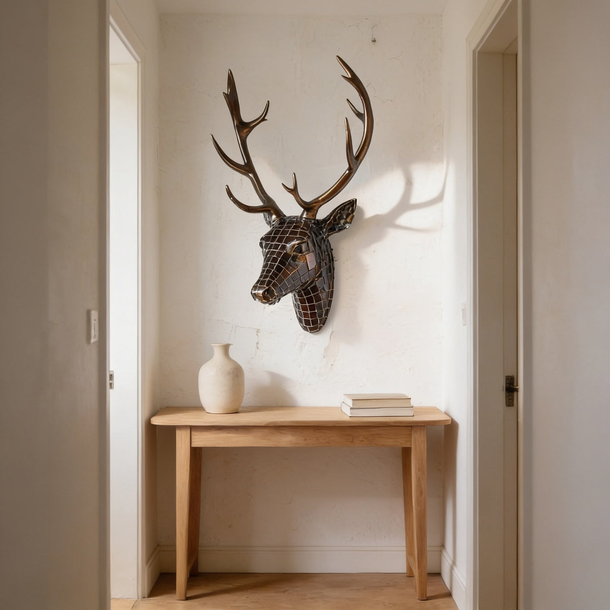 Bronze mosaic deer head with bronze antlers.