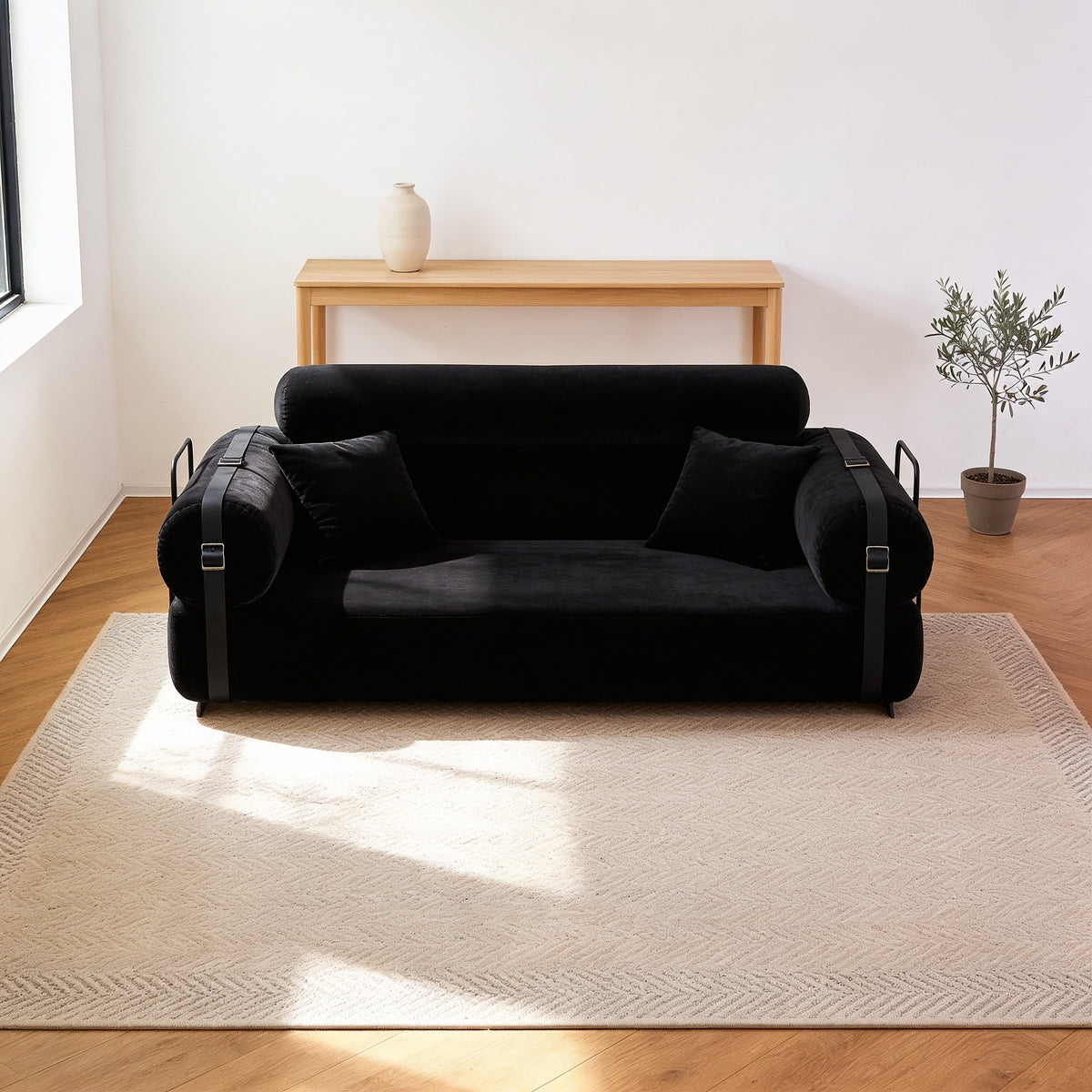 Black corduroy folding sofa bed in sofa mode, fifty-nine inch size.