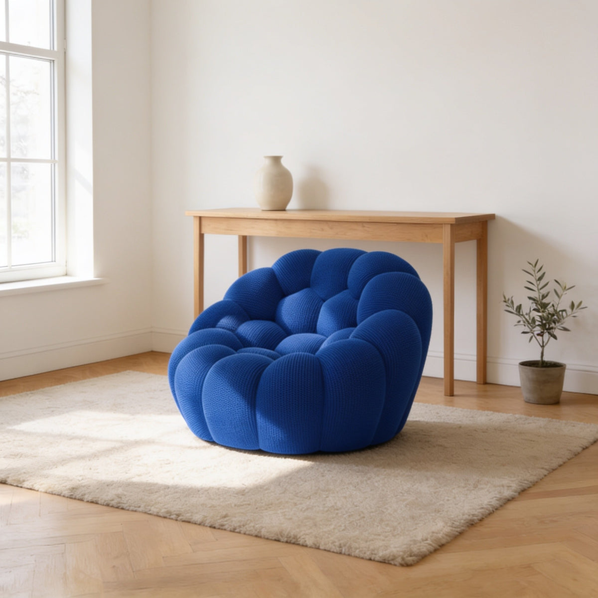 Klein blue bubble armchair in a three-dimensional mesh knit, one hundred and twenty-four centimetres wide.