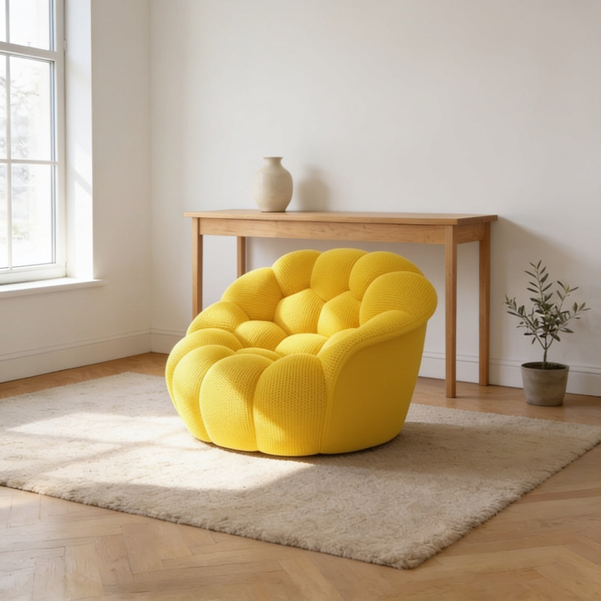 Lemon yellow bubble armchair in a three-dimensional mesh knit, one hundred and twenty-four centimetres wide.