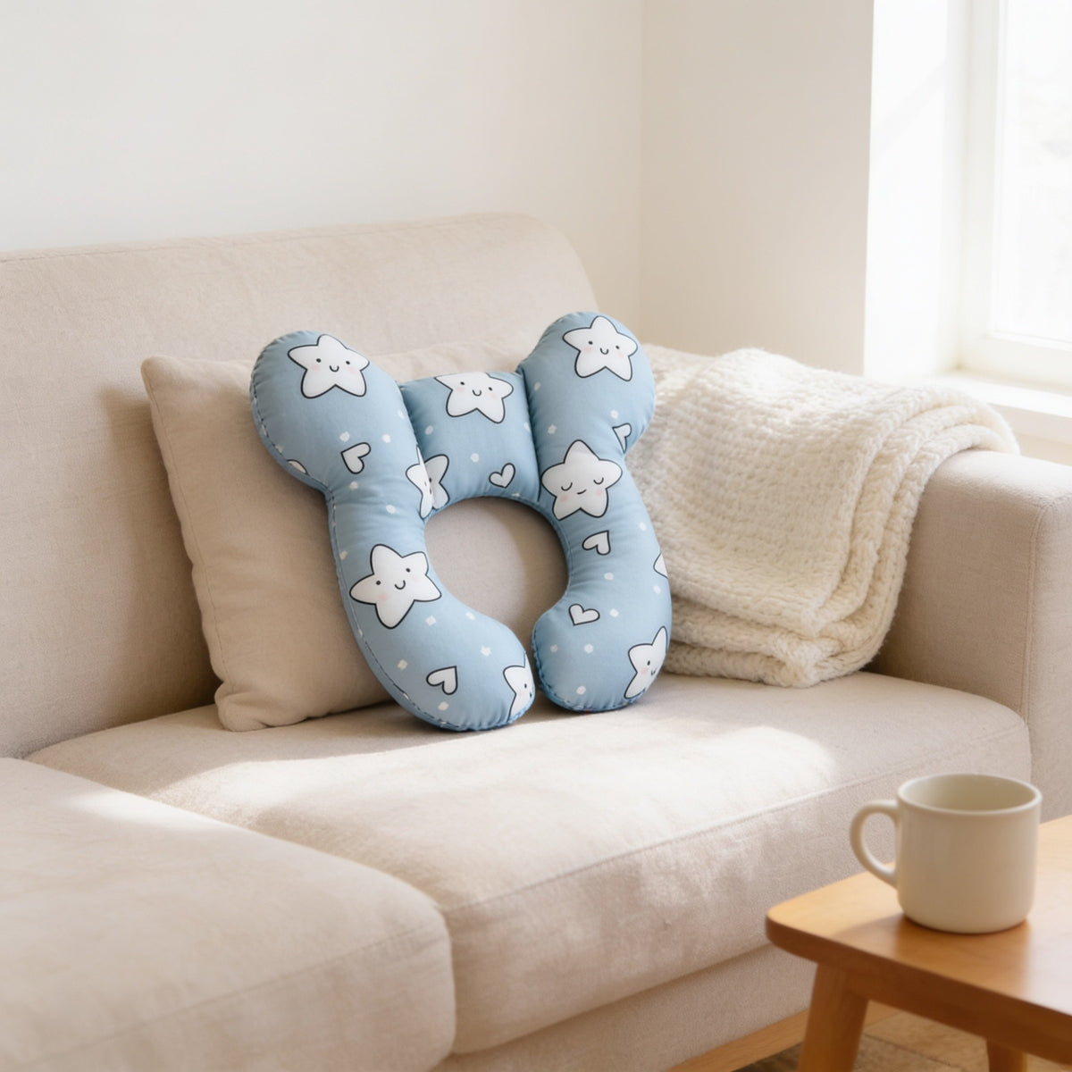 Sky blue smiling star print U-shaped toddler neck pillow.