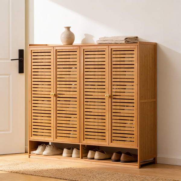 Four-door bamboo-frame shoe cabinet with slotted doors, 107 cm tall, with shoes on the open bottom shelf in a bright entryway