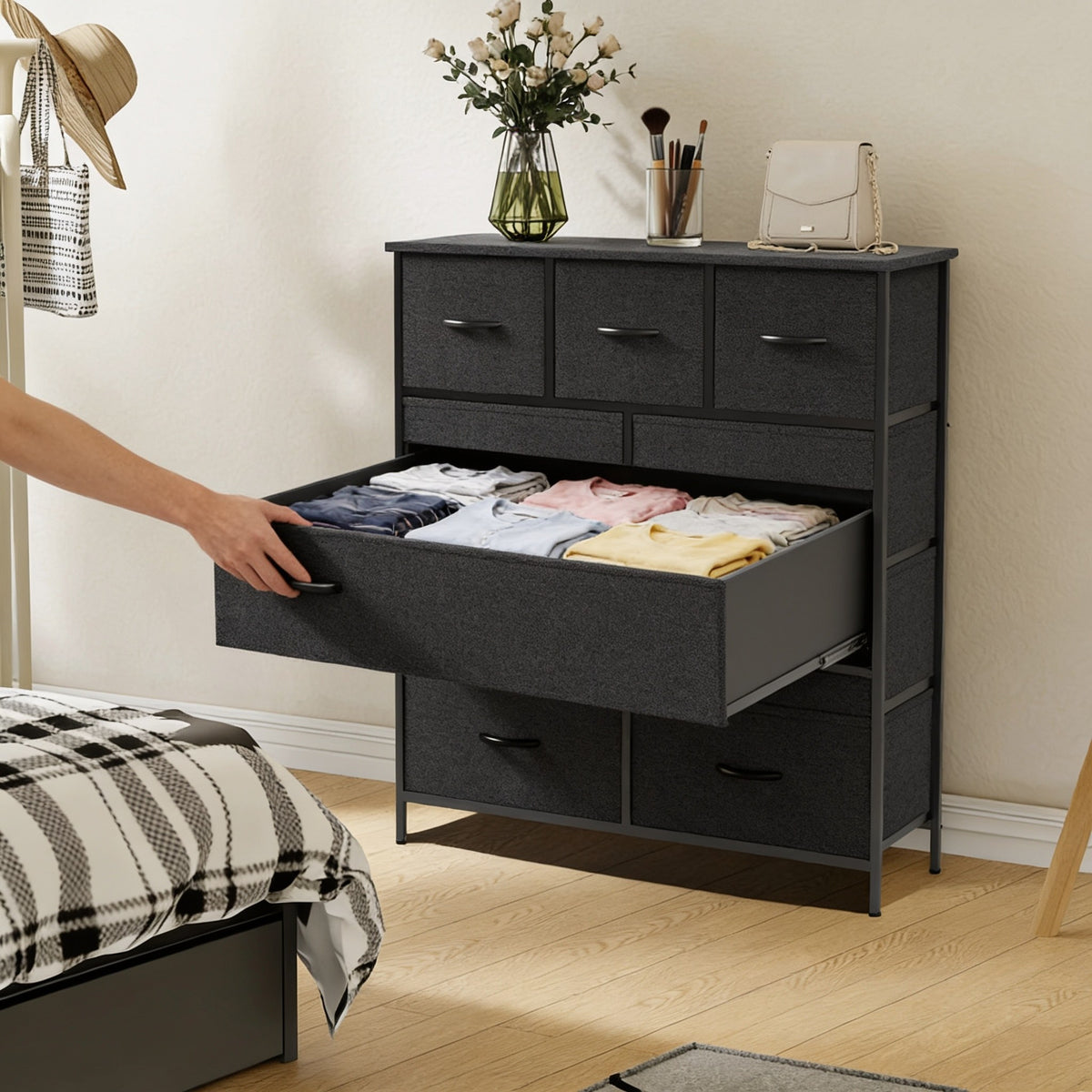 Large fabric drawer pulled open showing neatly folded T-shirts.