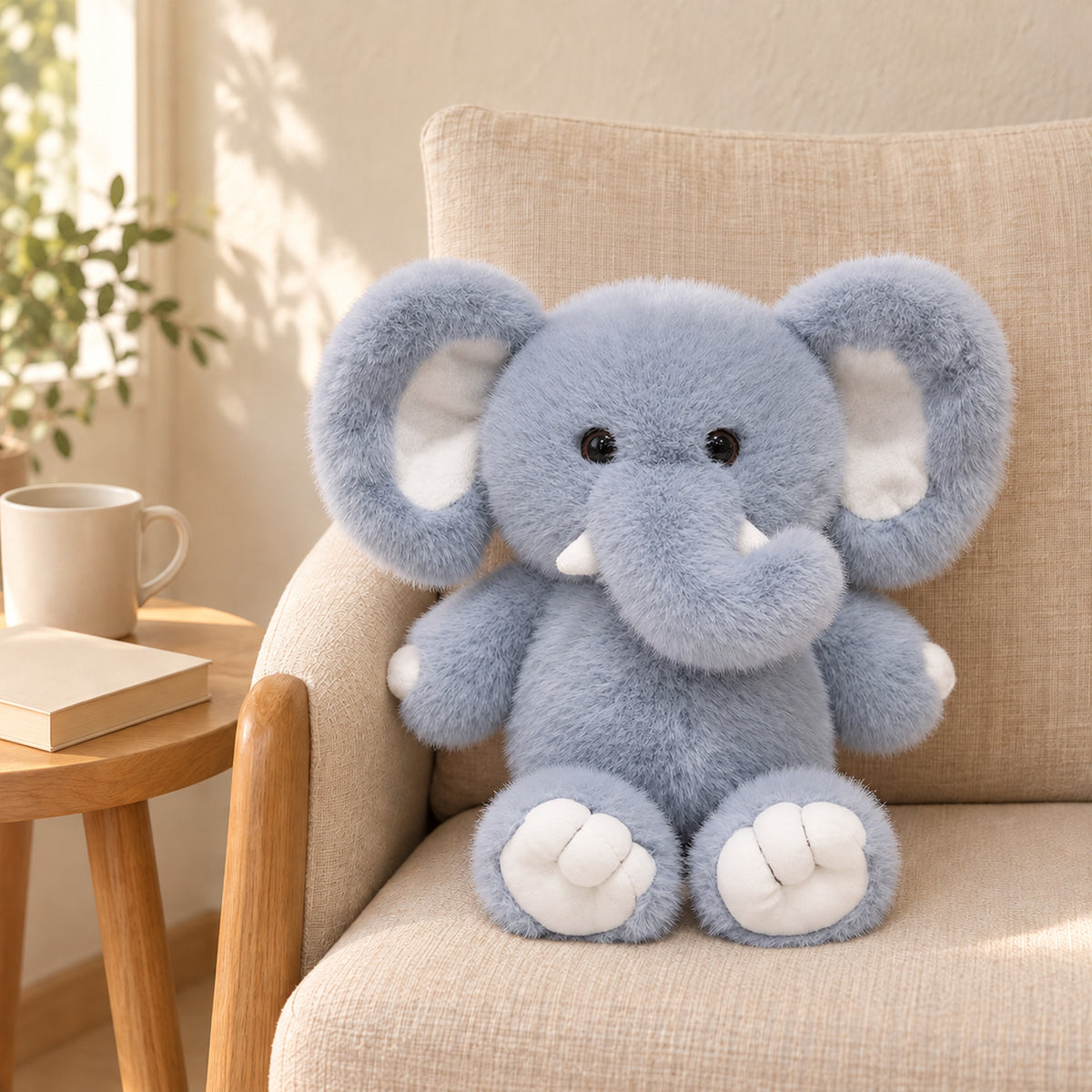 Blue-gray elephant plush without a diaper seated on the same oatmeal reading chair