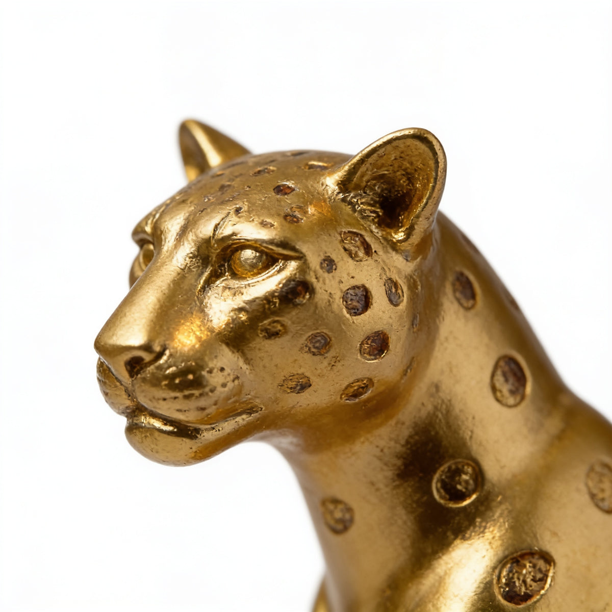 Close-up of the spotted gold finish on the leopard statue