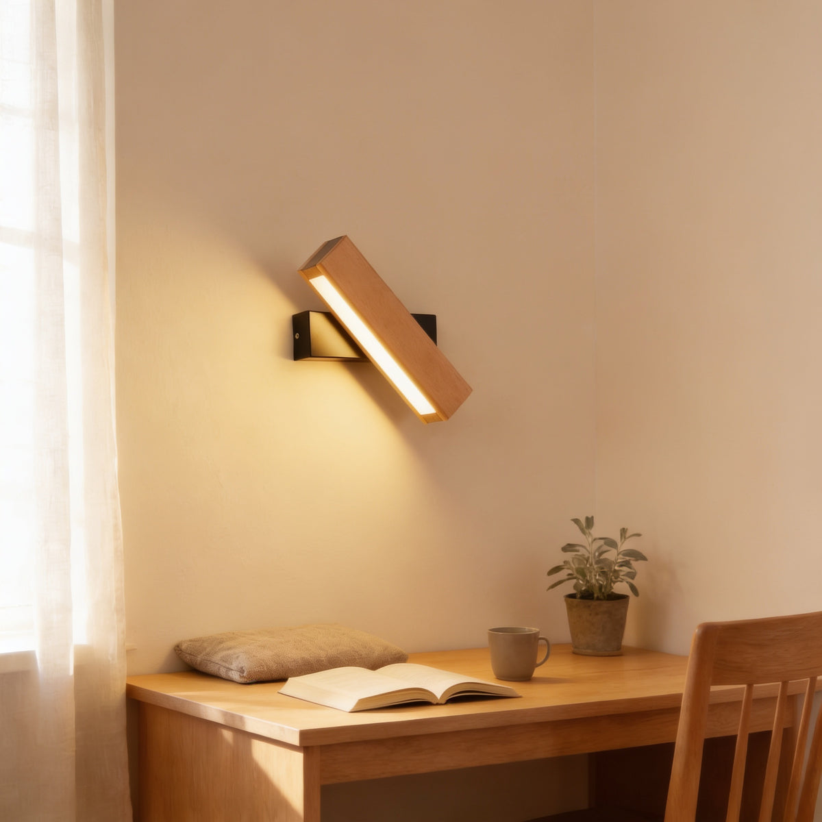 Beech swivel wall sconce lighting an oak desk with an open book — Hardwired Solid Wood Swivel Wall Sconce