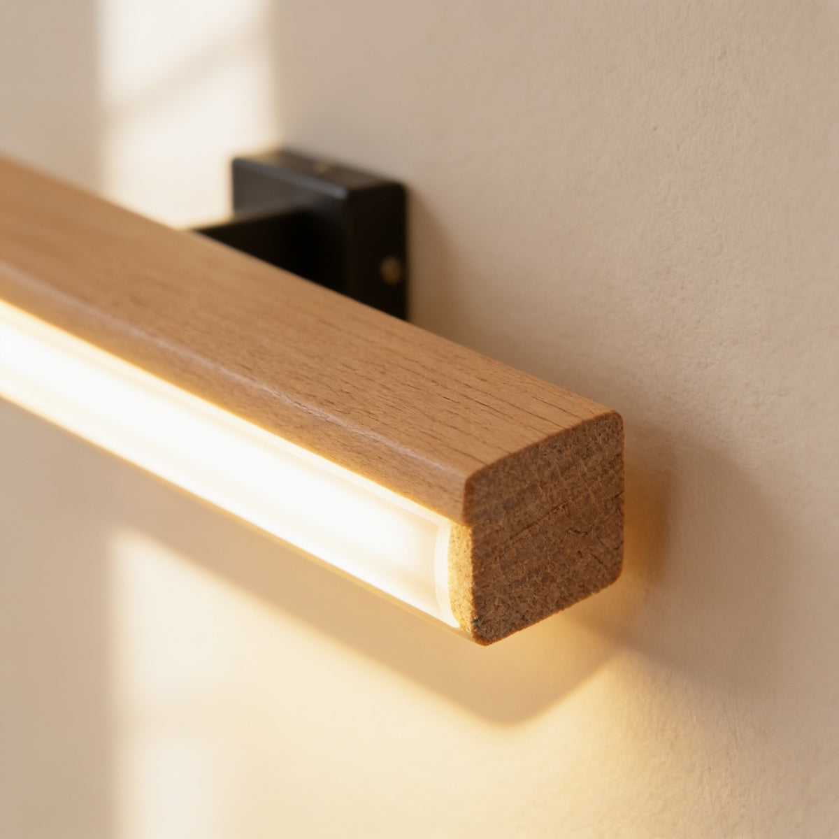 Close-up of the solid beech grain and frosted LED strip — Hardwired Solid Wood Swivel Wall Sconce