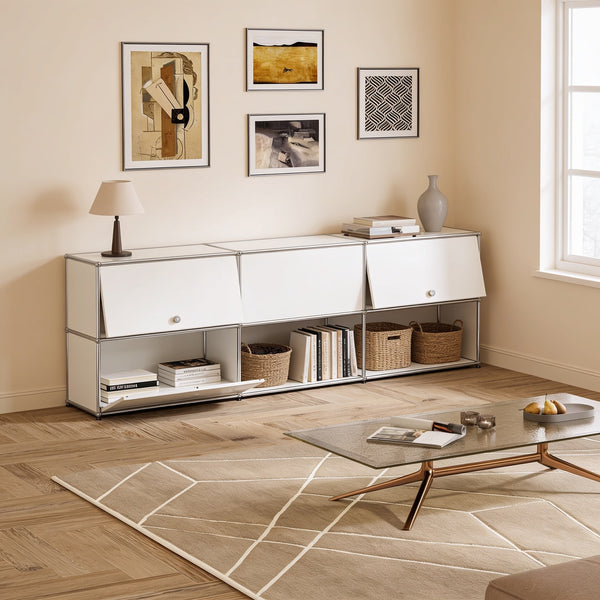 White modular metal sideboard with chrome tube frame, three drop-down doors over an open shelf row, 227.5 cm wide, in a bright living room.