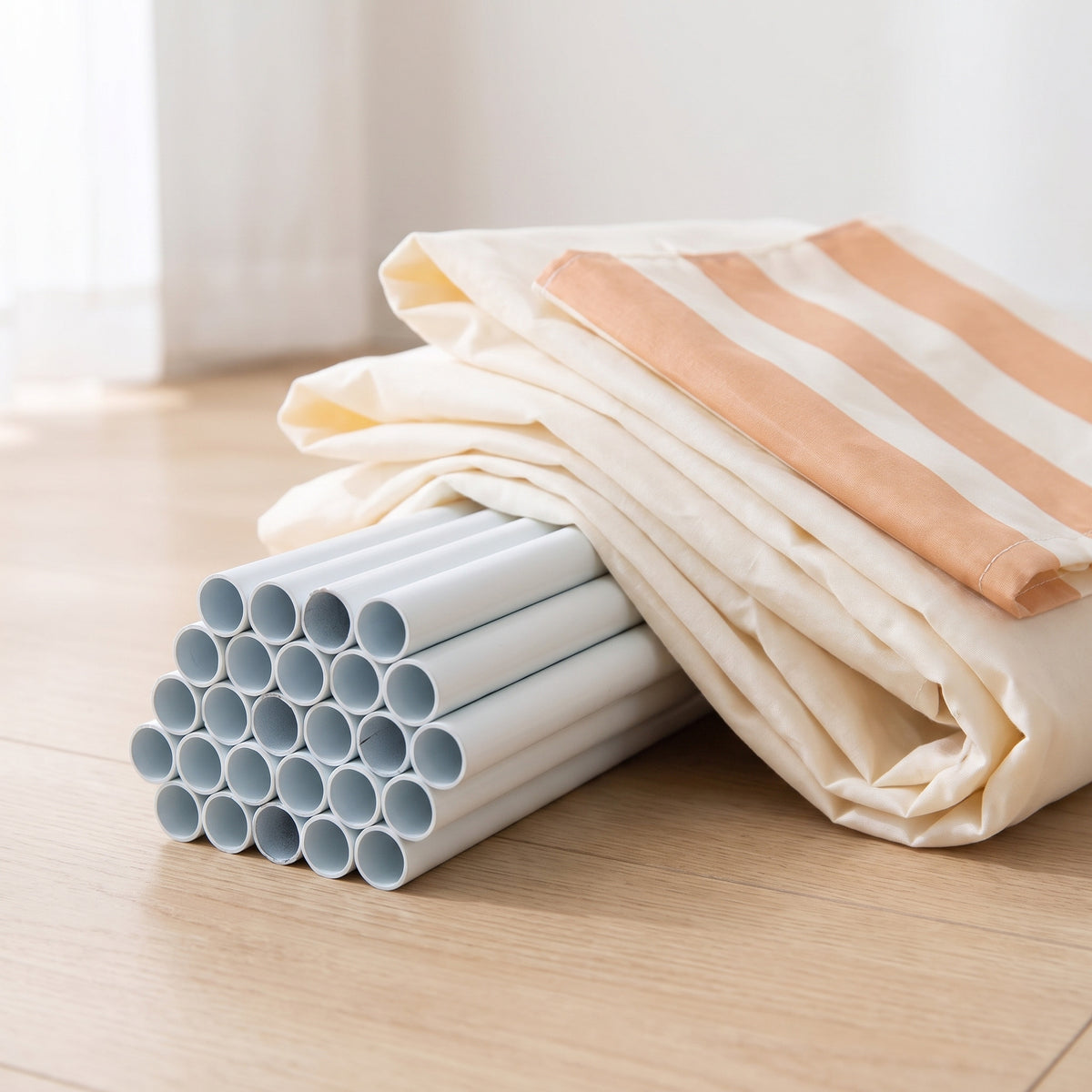 What is included: the folded cream fabric shell and the bundle of frame tubes