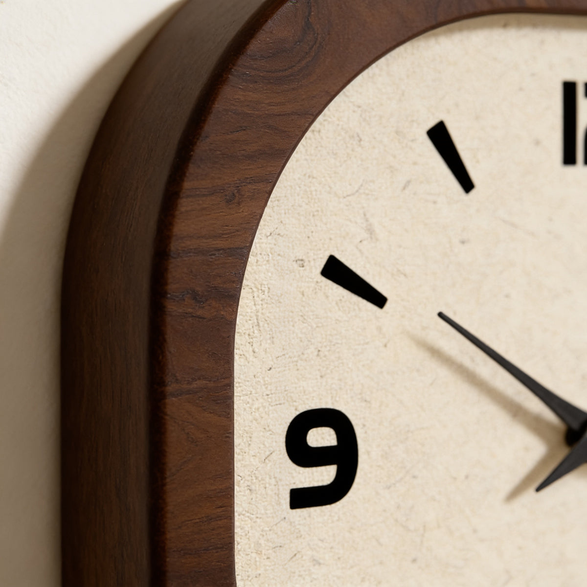 Close-up of the walnut-tone frame corner, cream dial and numeral 3 — Rounded Square Wood Wall Clock