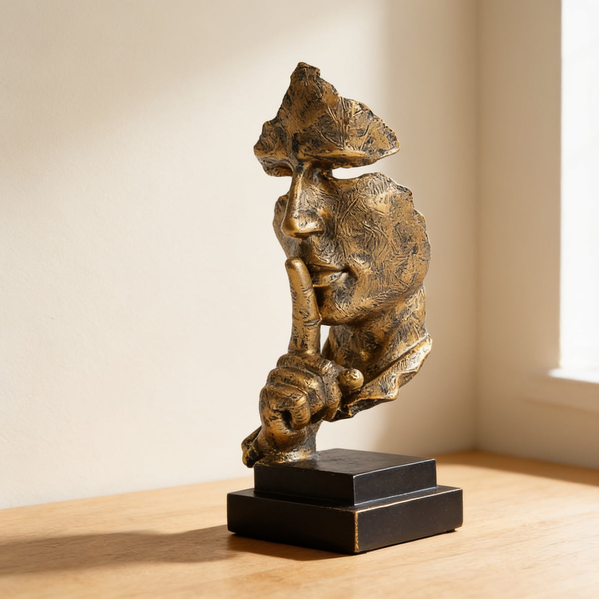 Detail of the square dark base of the thinker statue — Silence Is Golden Thinker Statue