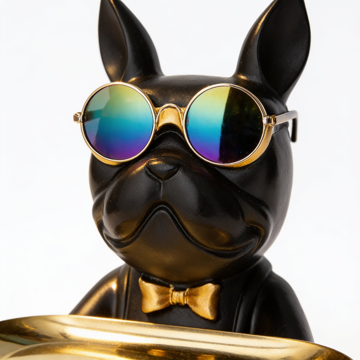 Close-up of the sunglasses and gold bow tie on the bulldog butler statue