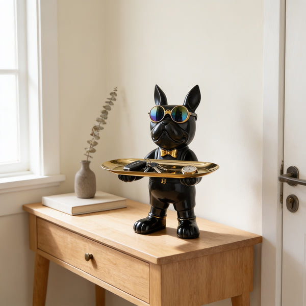 Black standing French bulldog butler statue holding a tray on an entryway console