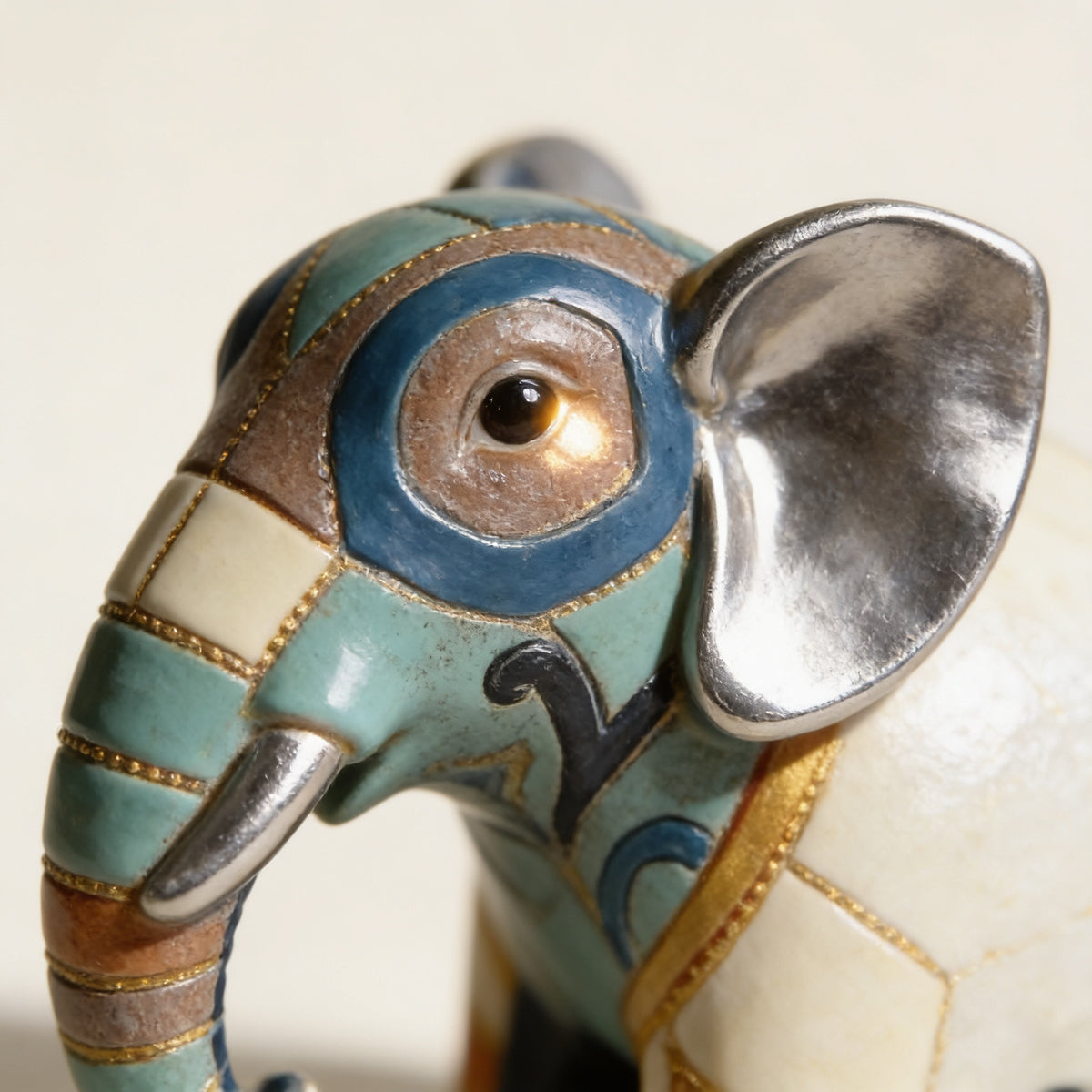Close-up of the painted trim and silver trunk on the elephant statue