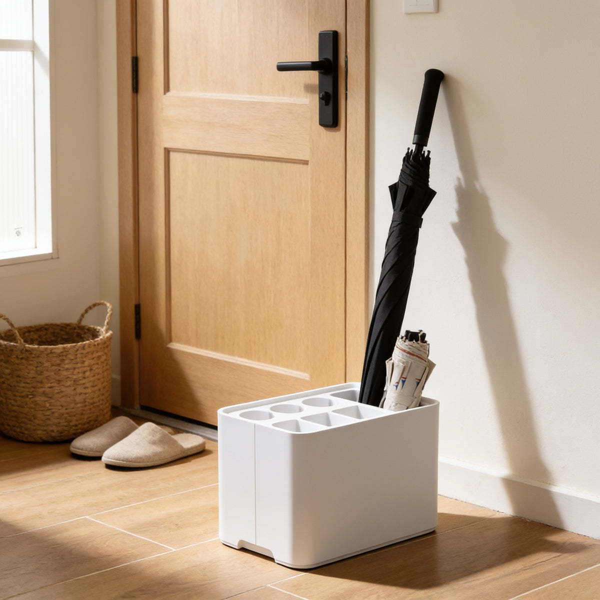 White six-slot umbrella stand with drip tray by a front door