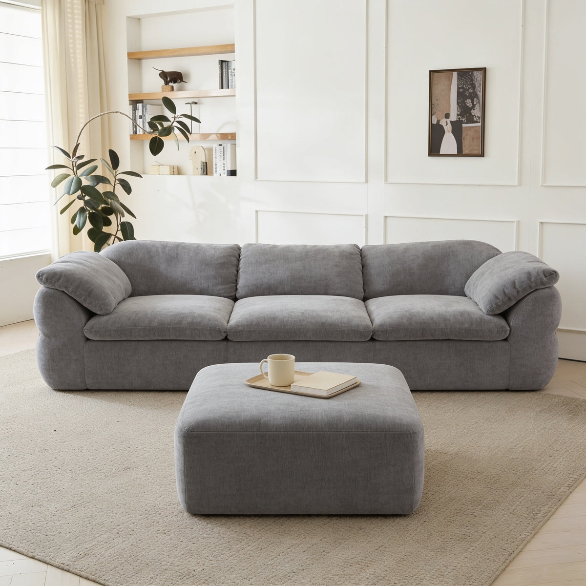 Gray chenille modular cloud couch with ottoman.