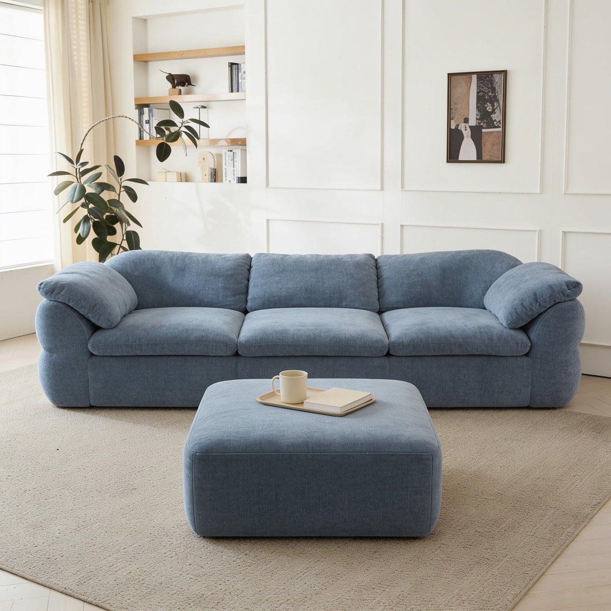 Slate blue chenille modular cloud couch with ottoman.