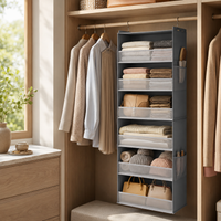 Gray 6-shelf hanging closet organizer with side pockets holding folded knits, towels, beanies and handbags
