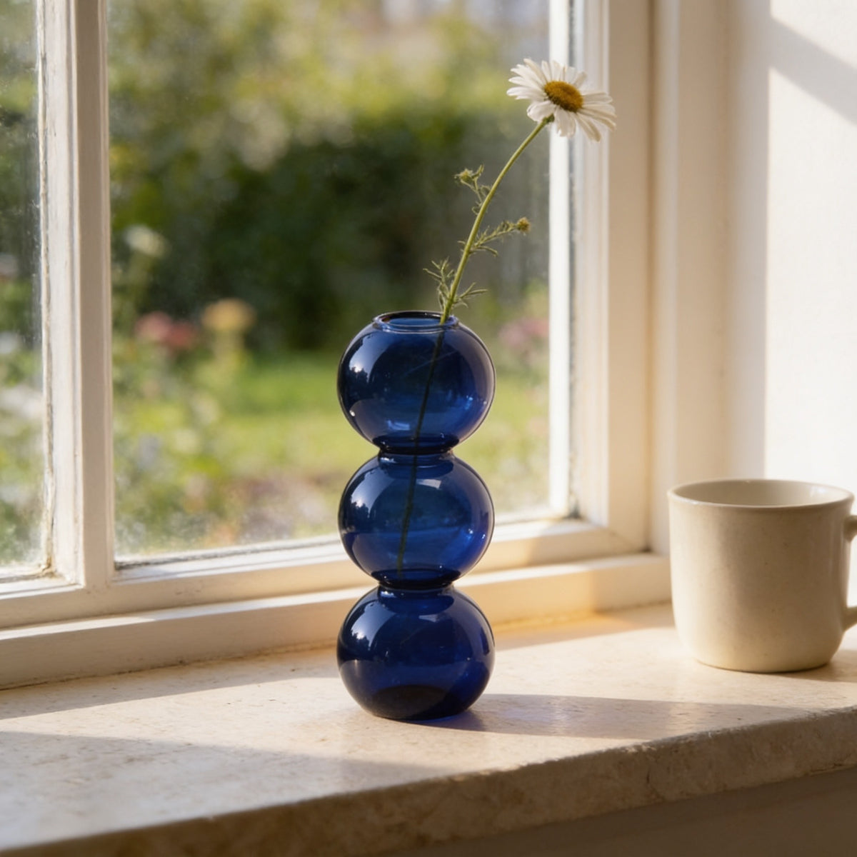 Cobalt blue small three-bubble glass vase.