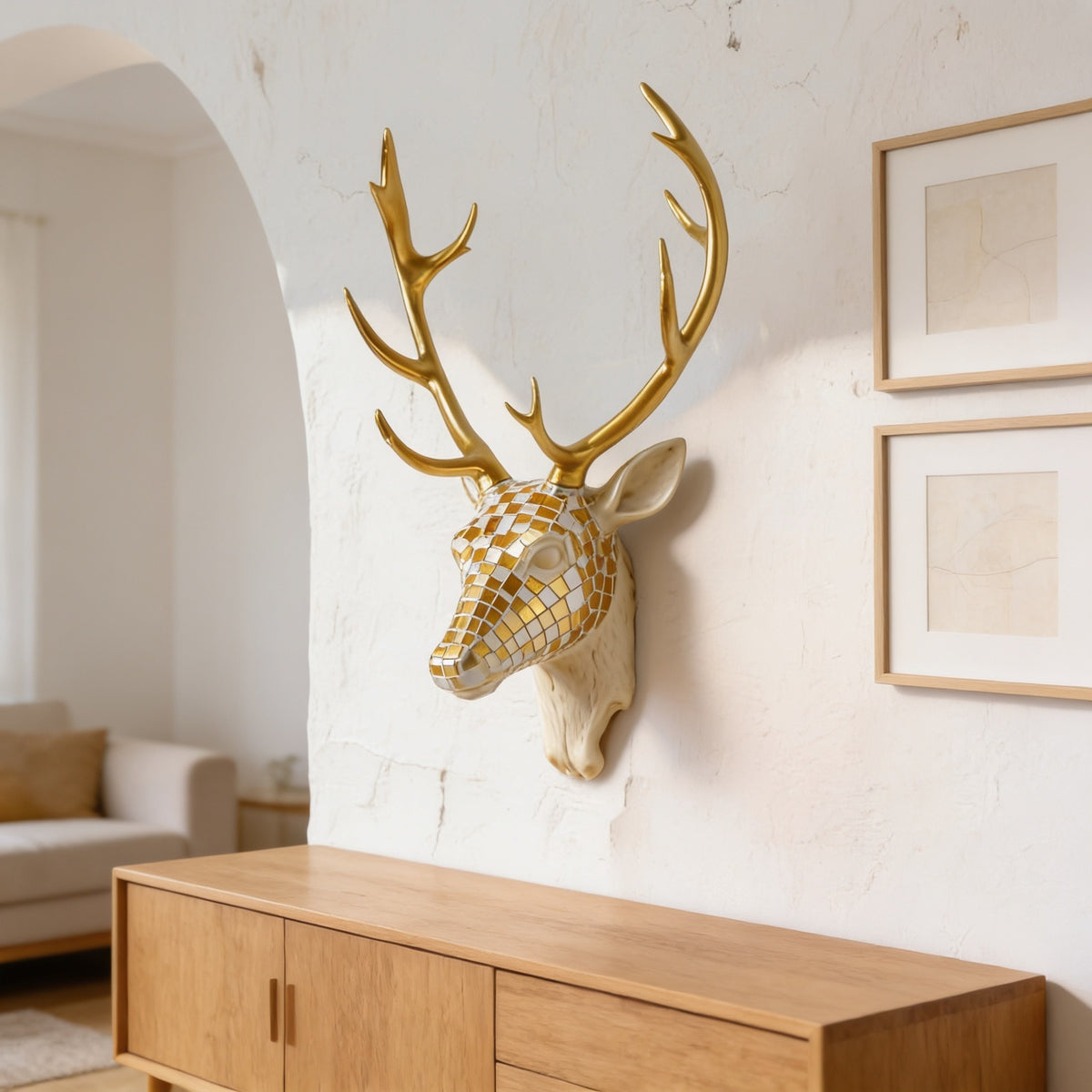 Mosaic deer head wall decor hung beside framed prints in a living room.