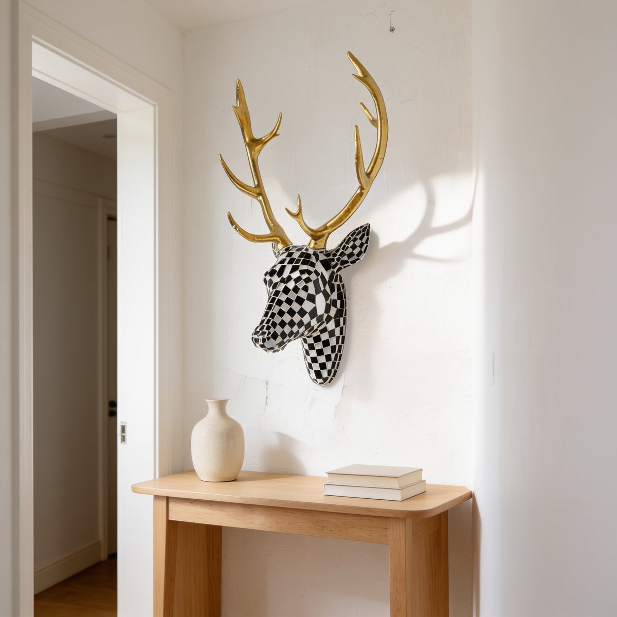 Black and white checkered mosaic deer head with gold antlers.