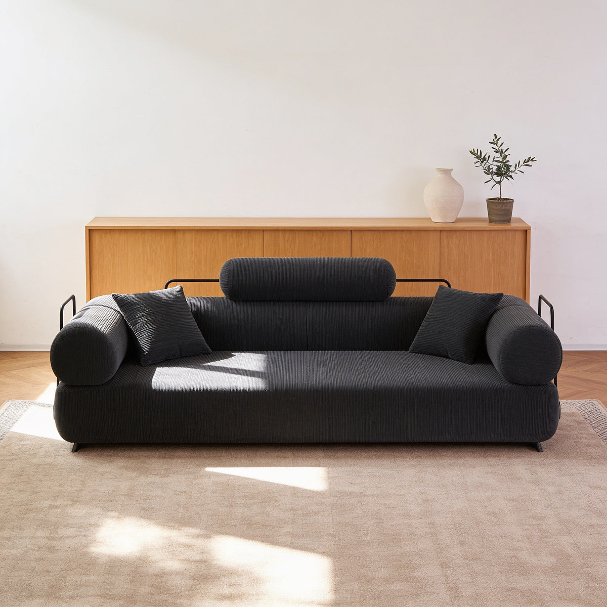 Dark grey corduroy folding sofa bed in sofa mode, fifty-nine inch size.