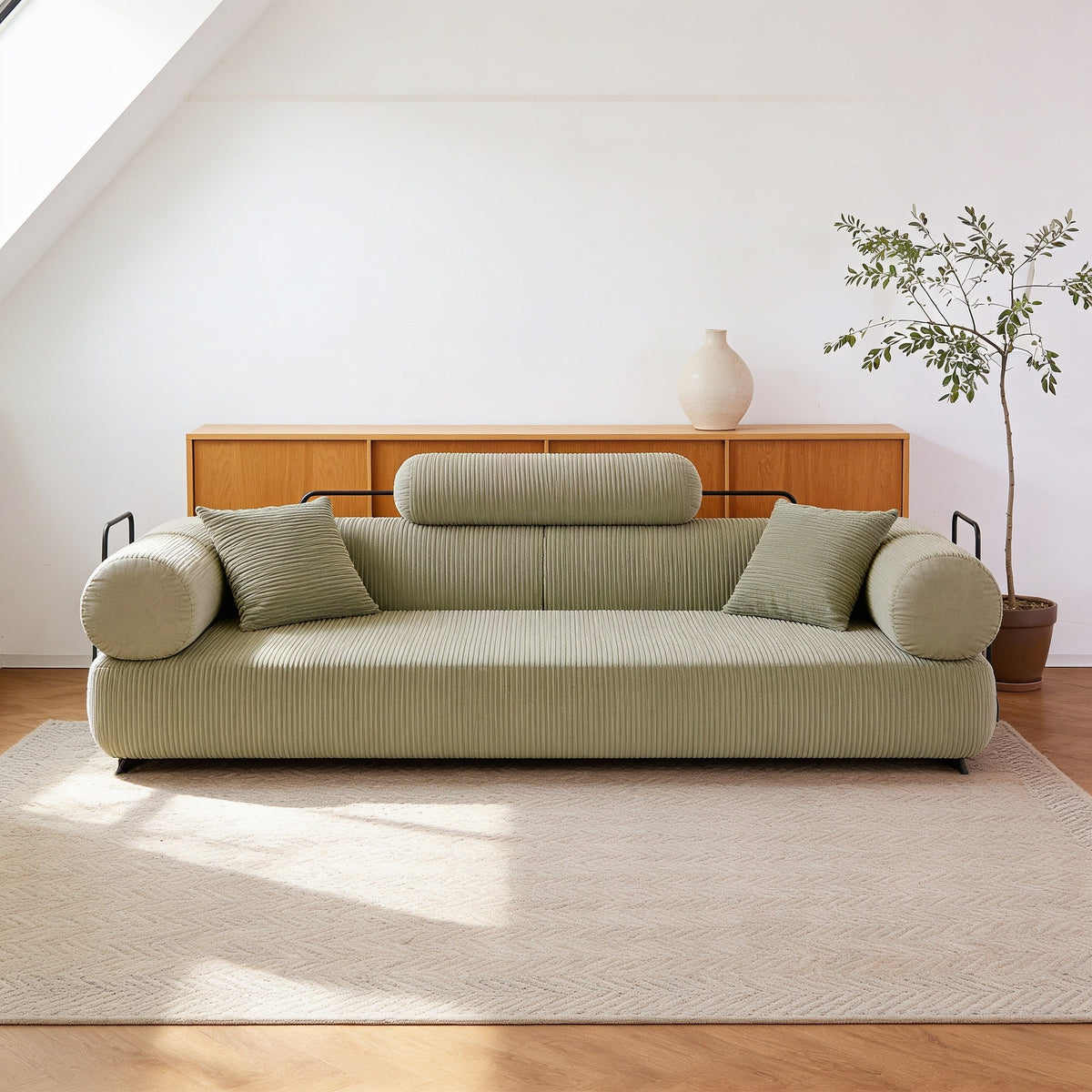 Light green corduroy folding sofa bed in sofa mode, fifty-nine inch size.