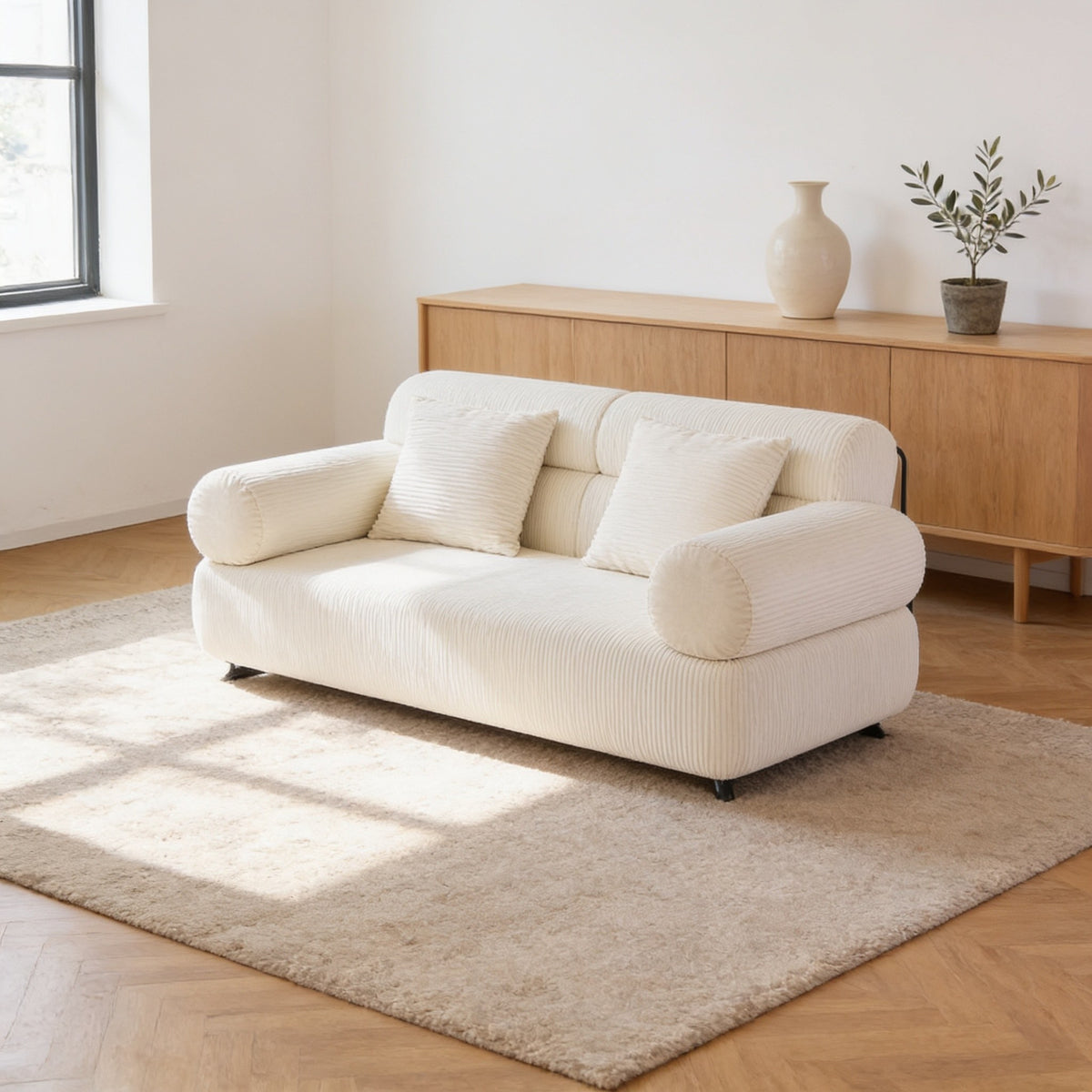 Cream white corduroy folding sofa bed in sofa mode, seventy-nine inch size.