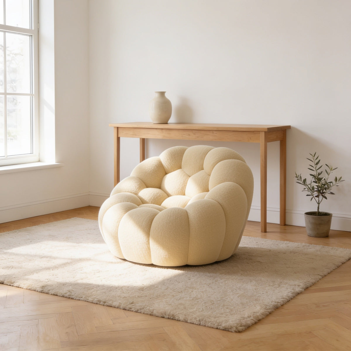 Oatmeal cream bubble armchair in a three-dimensional mesh knit, one hundred and twenty-four centimetres wide.