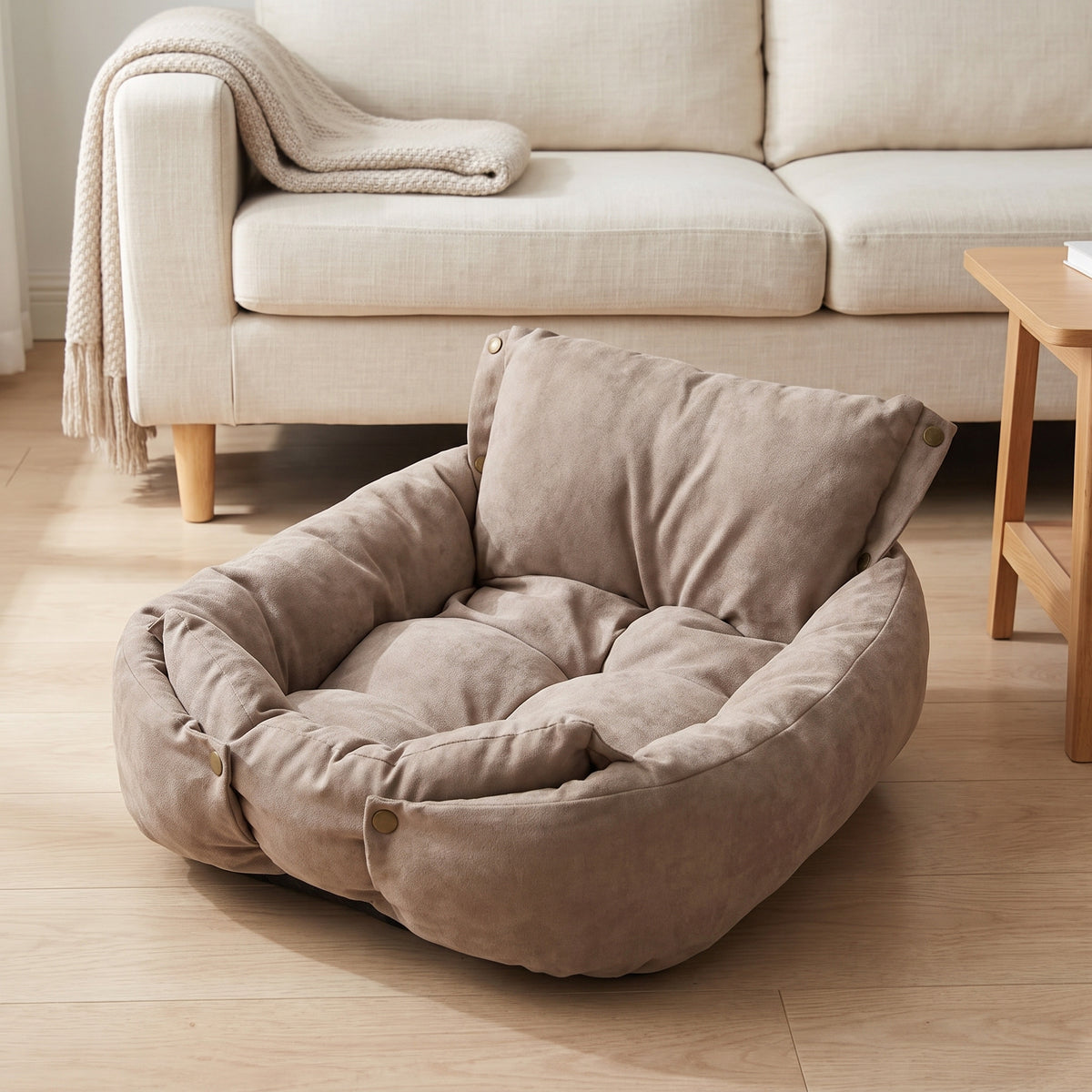 Taupe convertible pet bed in its walled shape on a living room floor