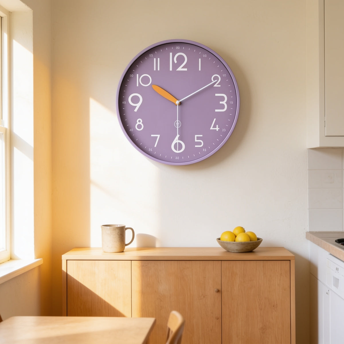 Purple bold numeral wall clock above an oak sideboard in a sunlit kitchen