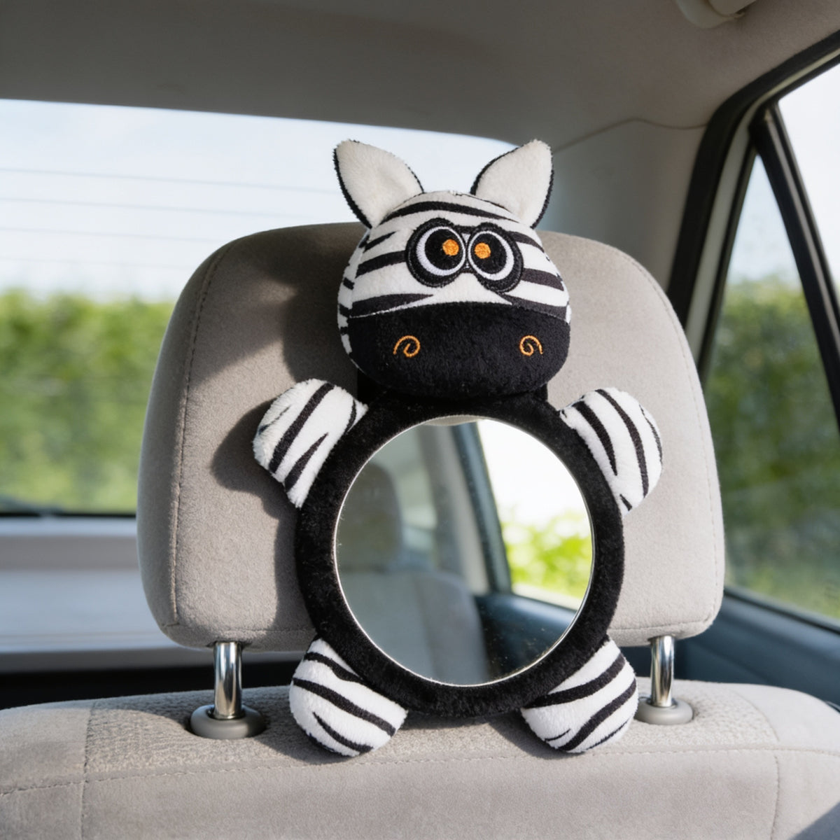 Black and white Zebra design rear-facing baby car mirror with a black plush ring on the same empty grey back-seat headrest