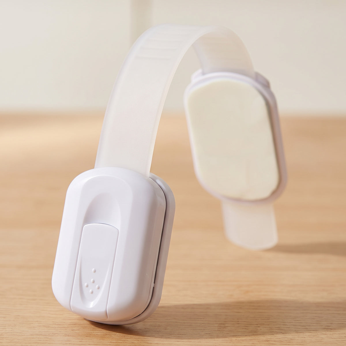 Close-up of the strap lock's catch block and slide button