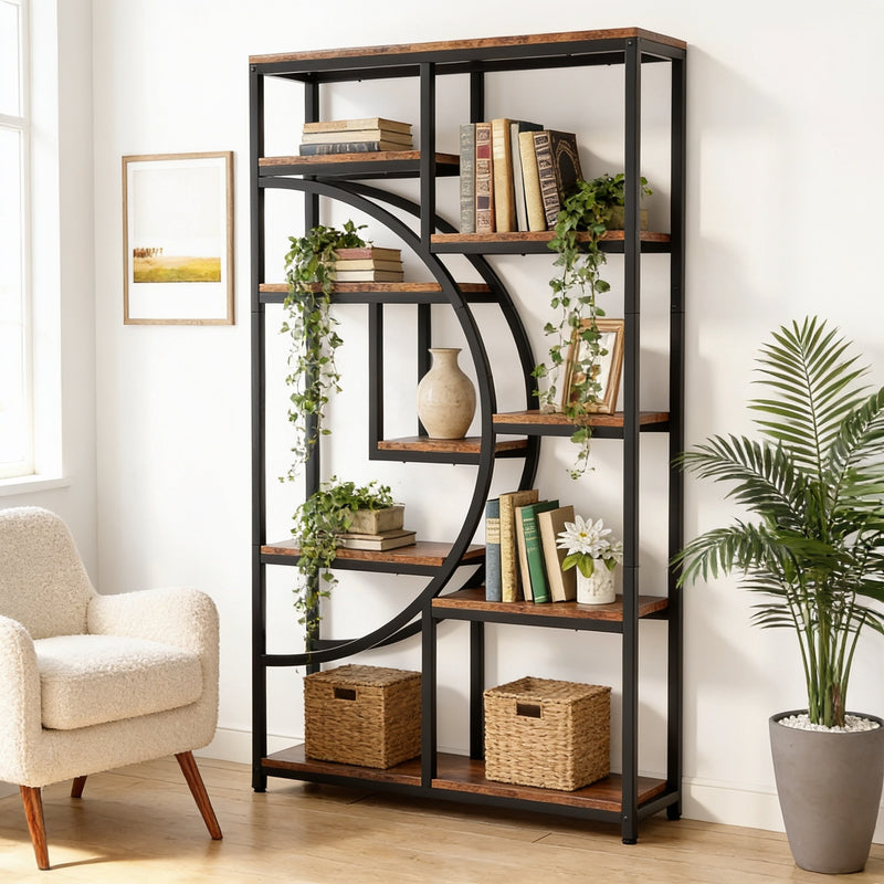 Industrial geometric etagere bookcase with a black iron half-moon arc and rustic brown shelves, styled with books and plants beside an armchair, 175 cm tall.
