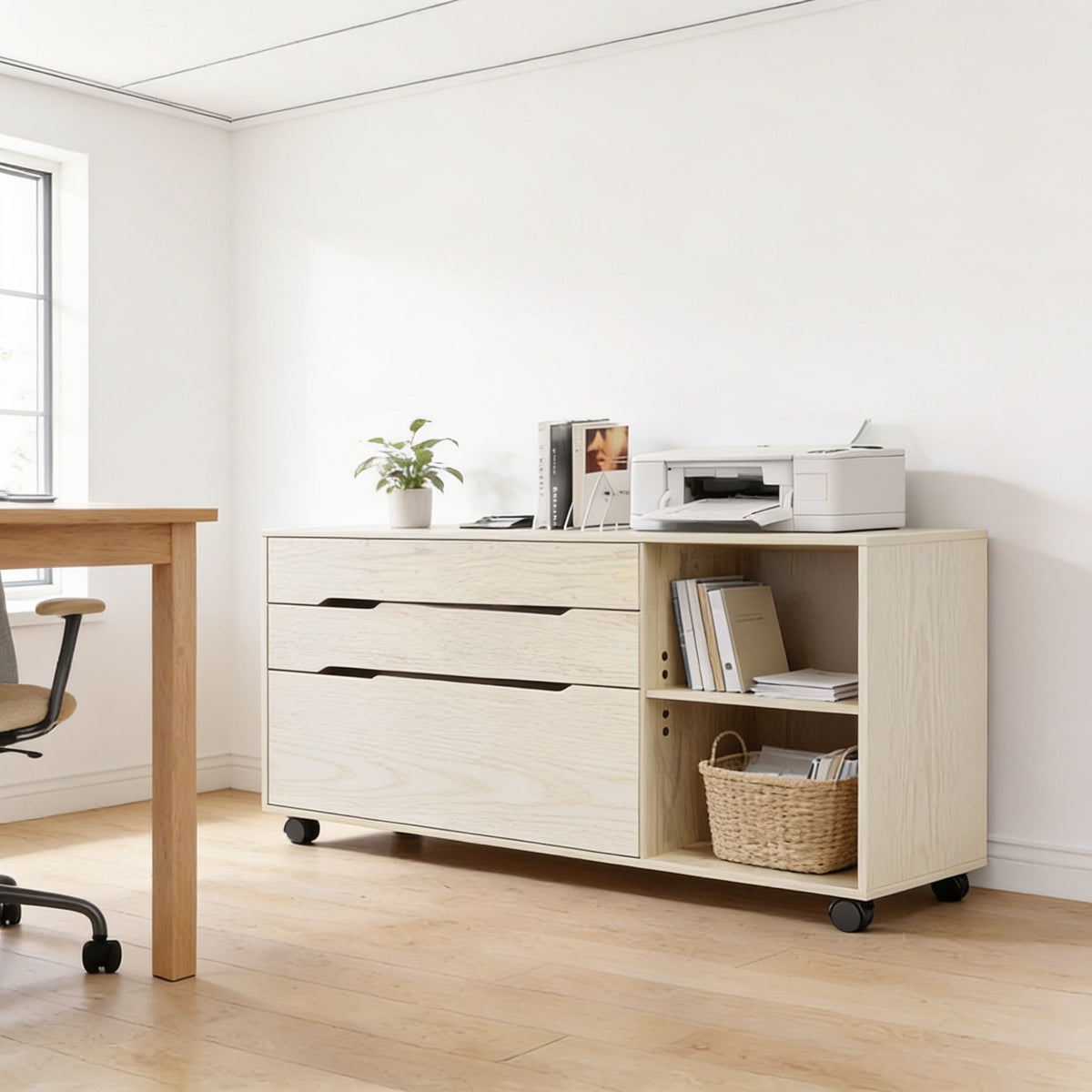 Ivory woodgrain mobile file cabinet with three drawers and open shelf beside a desk.
