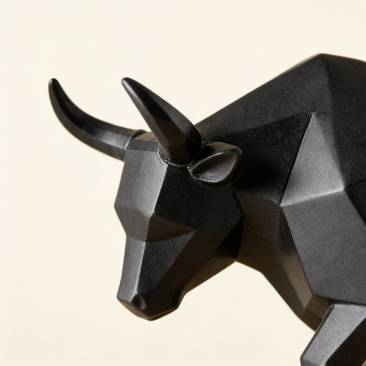 Close-up of the bull's faceted head and horns — Faceted Geometric Bull Statue