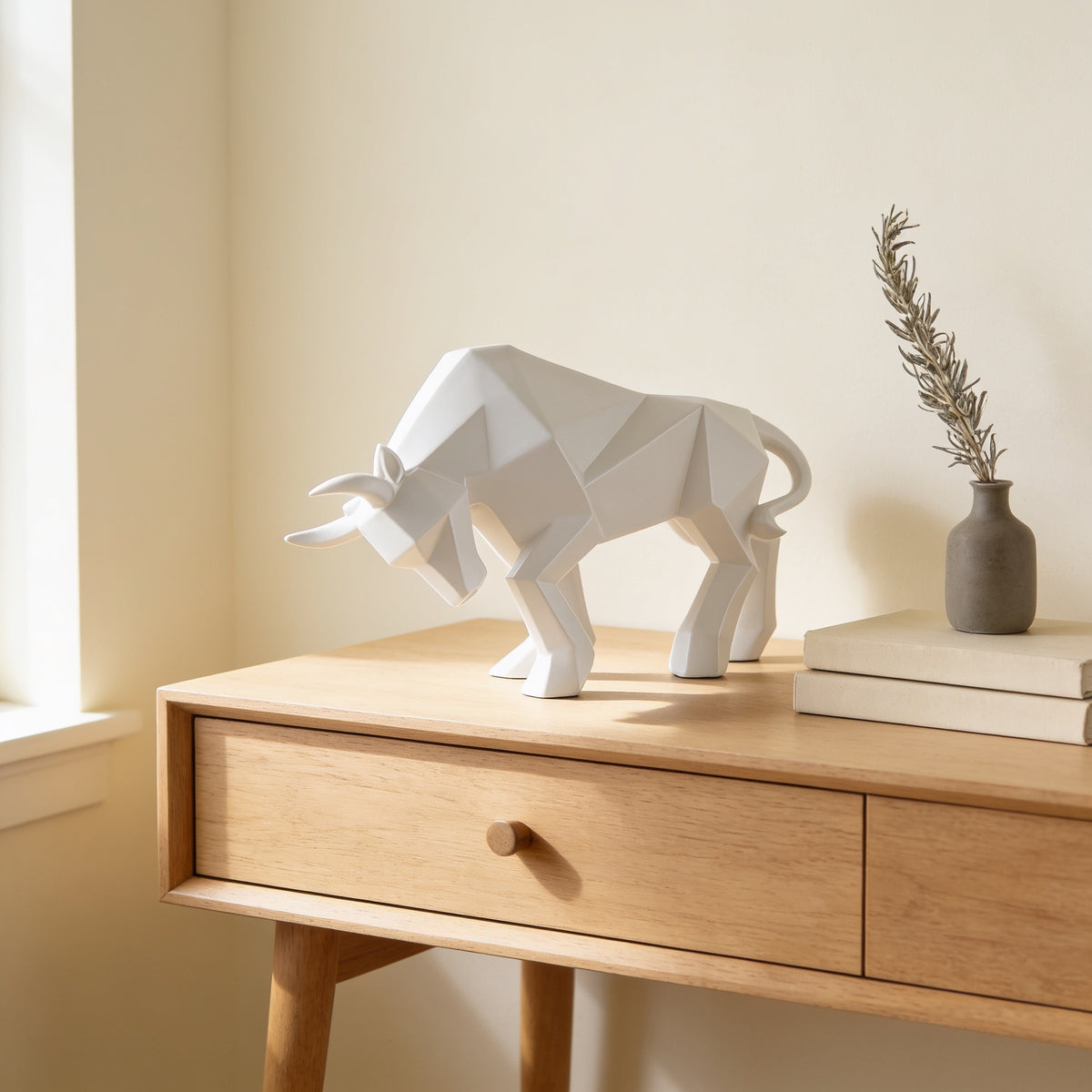 White faceted bull statue, large charging pose, on an oak console — Faceted Geometric Bull Statue