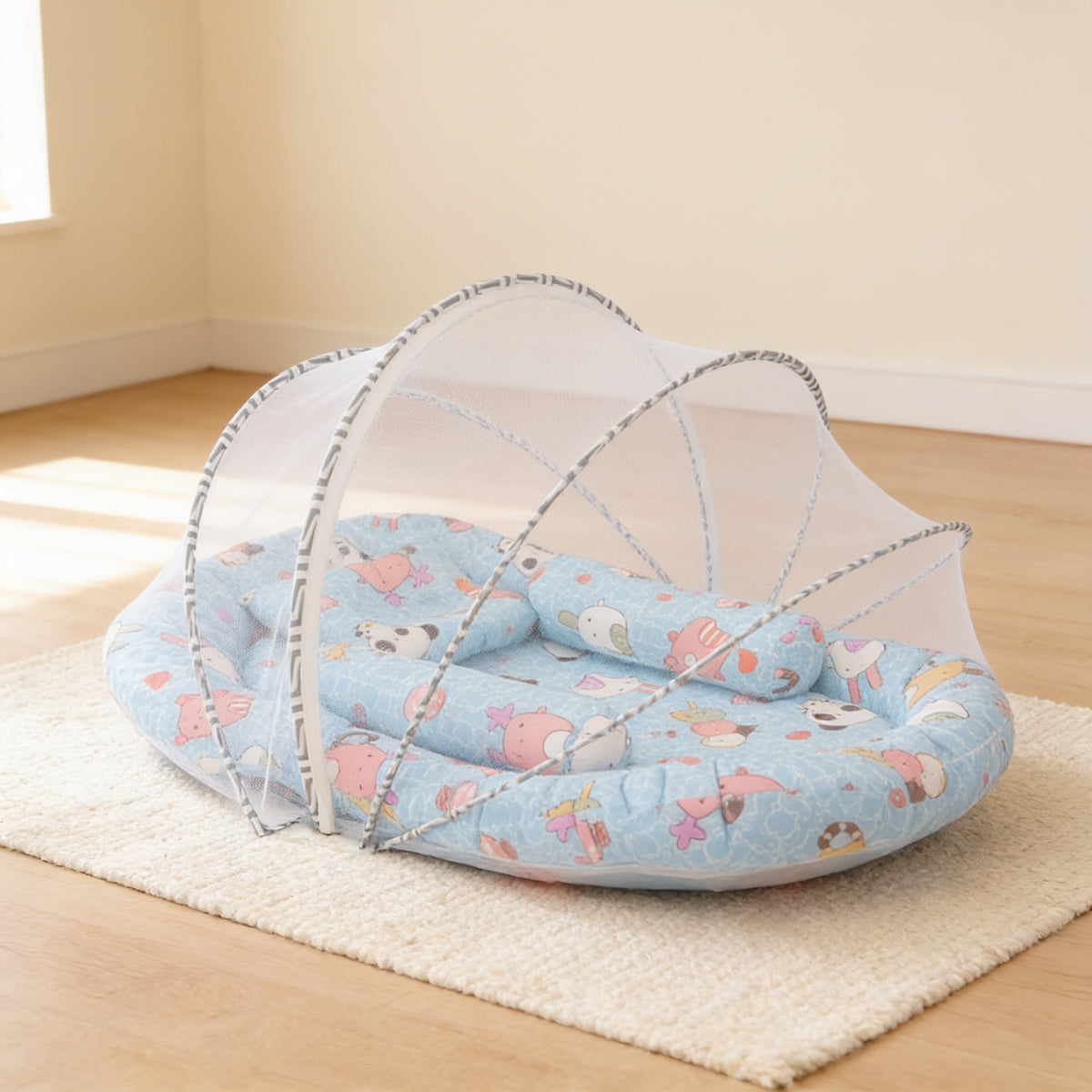 Blue Animals foldable travel bassinet, sky-blue cotton with cartoon animals and grey zigzag binding, with its mesh net dome up on a cream rug in a bright living room