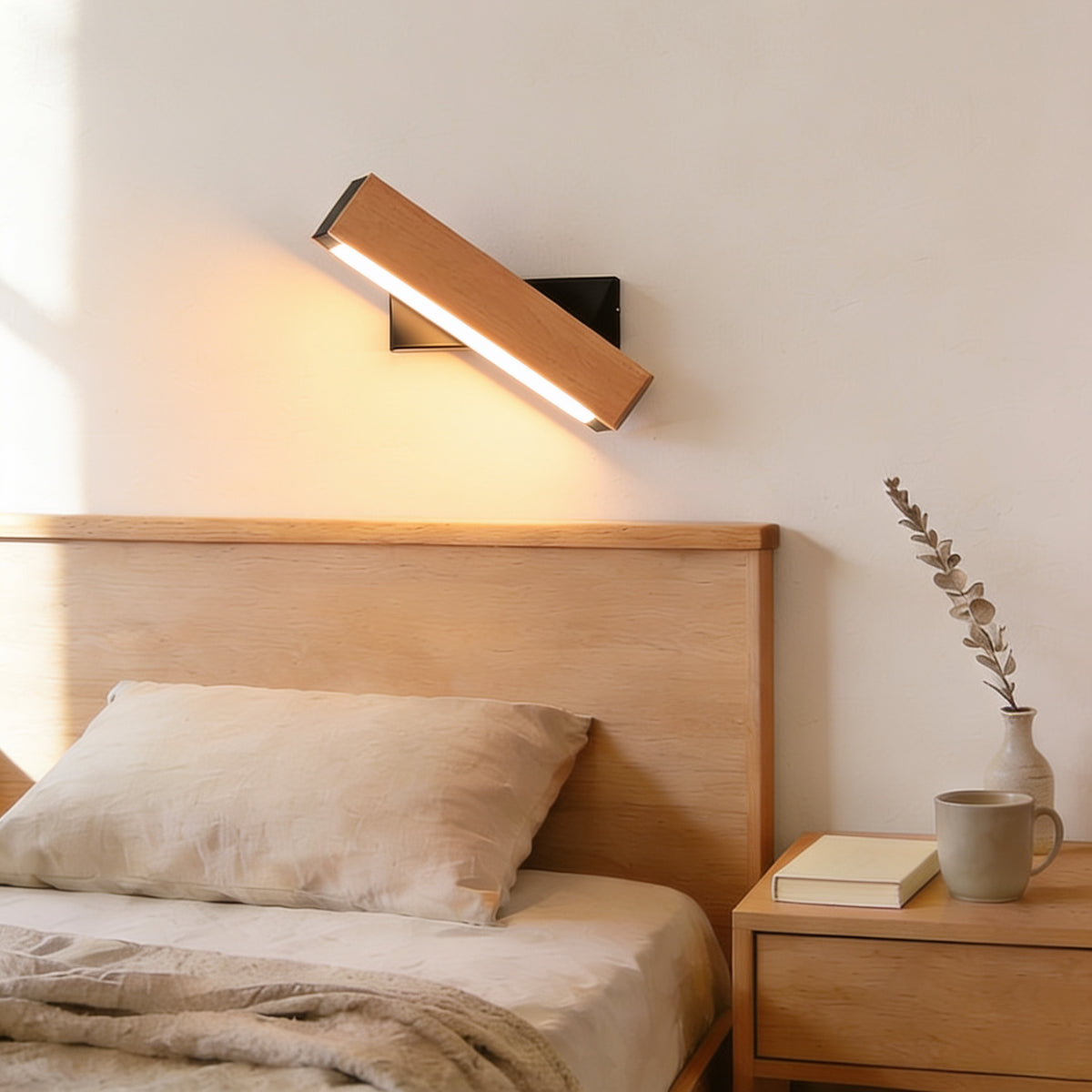Large beech swivel wall sconce, black bracket, warm white light, above an oak headboard — Hardwired Solid Wood Swivel Wall Sconce