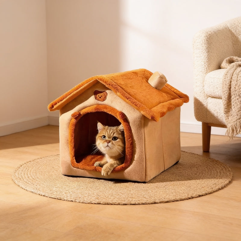 Cat peeking out of the orange house-shaped covered pet bed on a jute rug in a cosy living-room corner