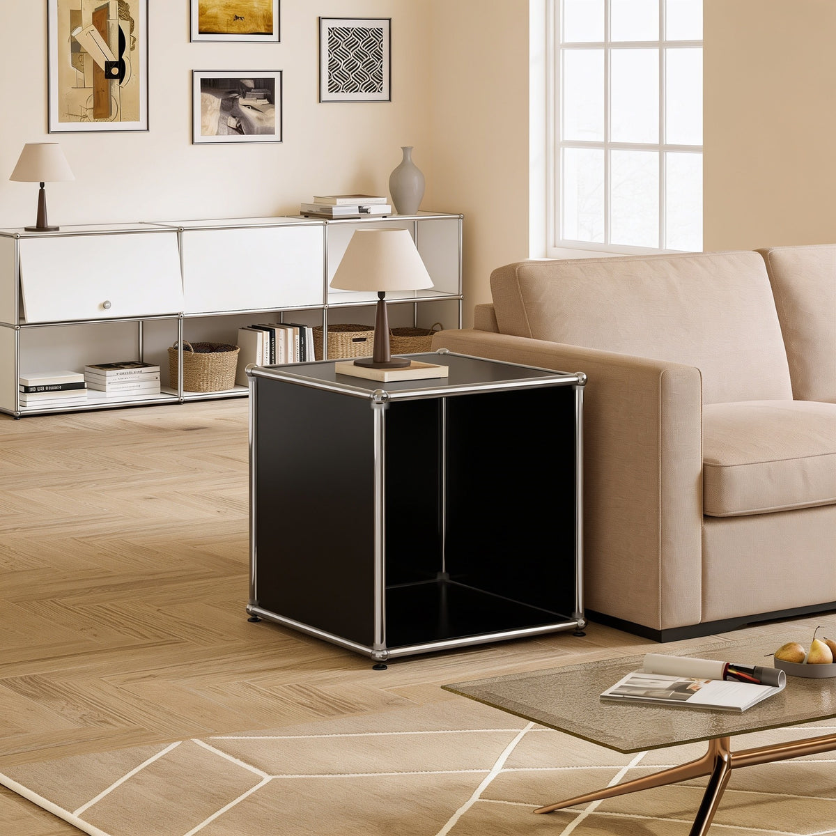 Black modular metal open cube side table with chrome frame and ball connectors in a living room.