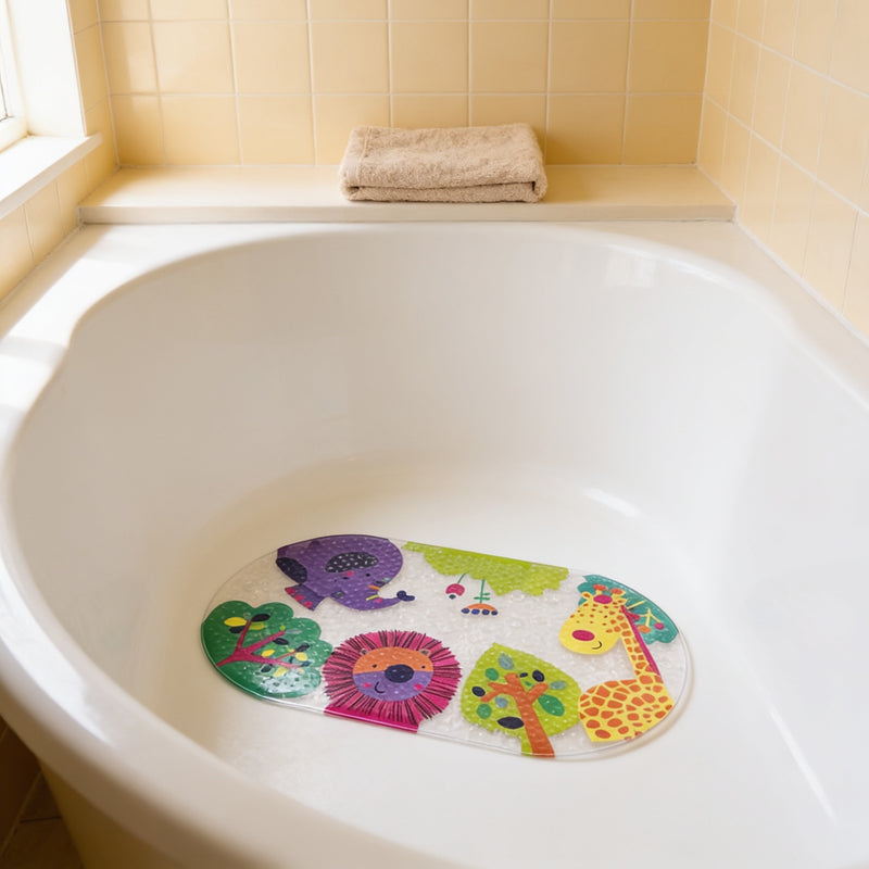 Zoo design kids non-slip bathtub mat with a cartoon elephant, lion and giraffe print, lying in an empty white bathtub