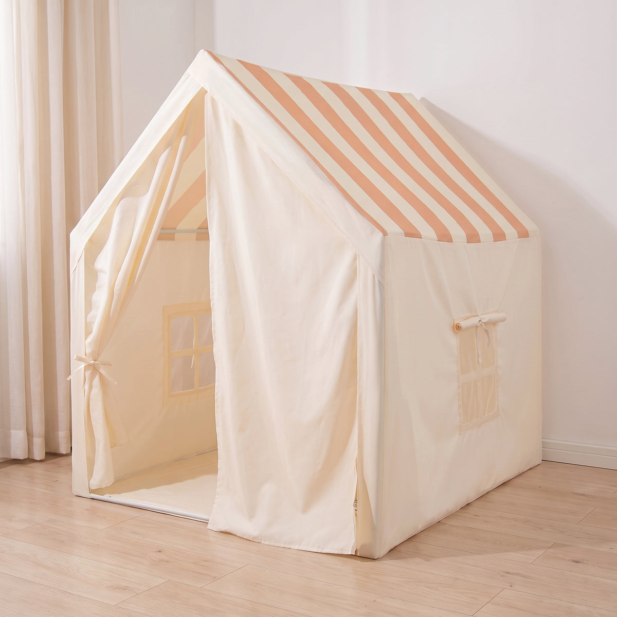 Play tent with one curtain door tied back and the other drawn across the front