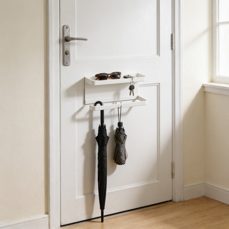 White magnetic umbrella and key holder with tray on a front door