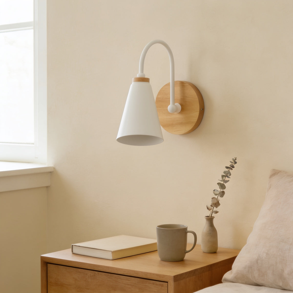 White cone wall sconce with solid wood base, switched off, above an oak nightstand — Nordic Wood & Metal Cone Wall Sconce