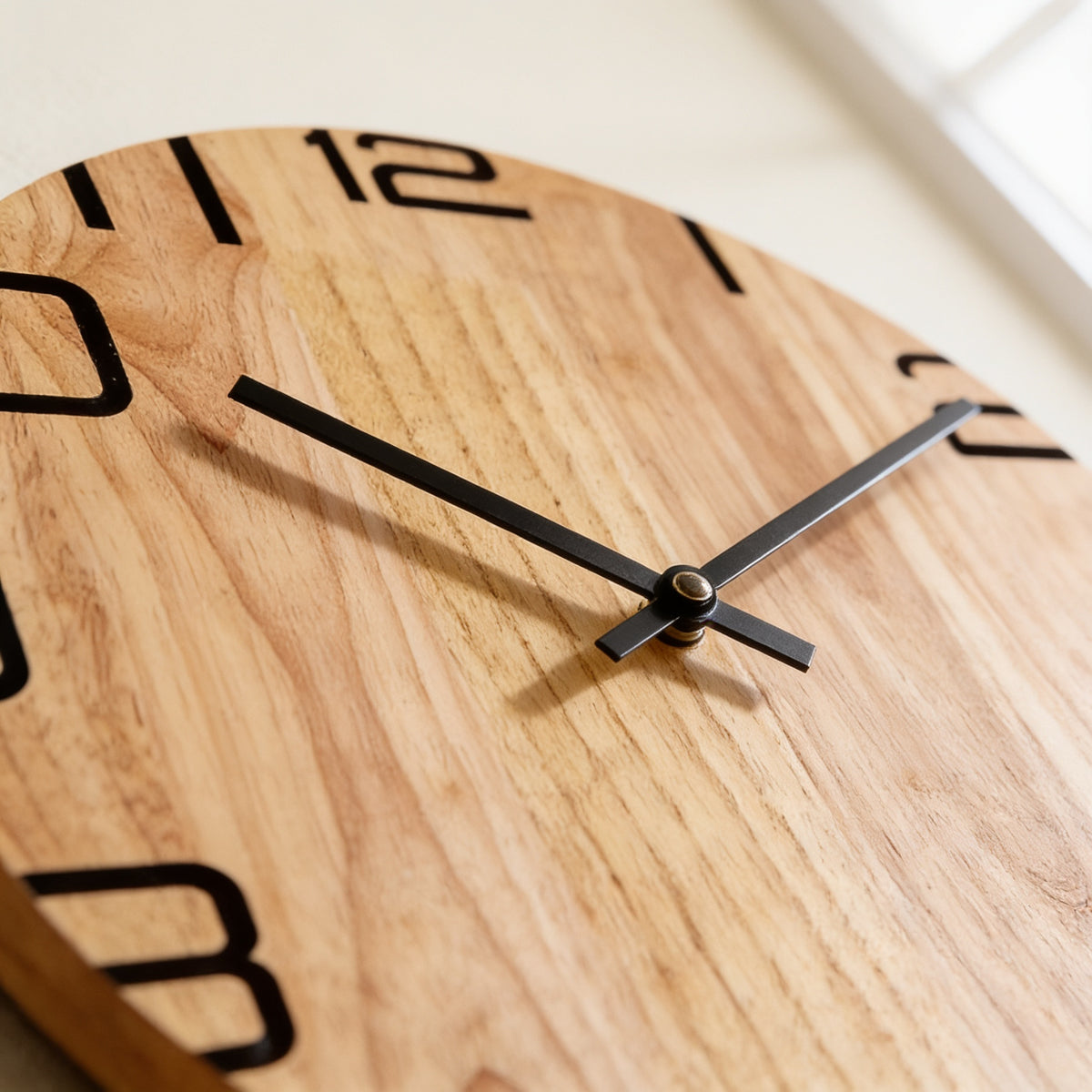 Close-up of the black hands and numerals on the natural wood grain — Silent Natural Wood Wall Clock